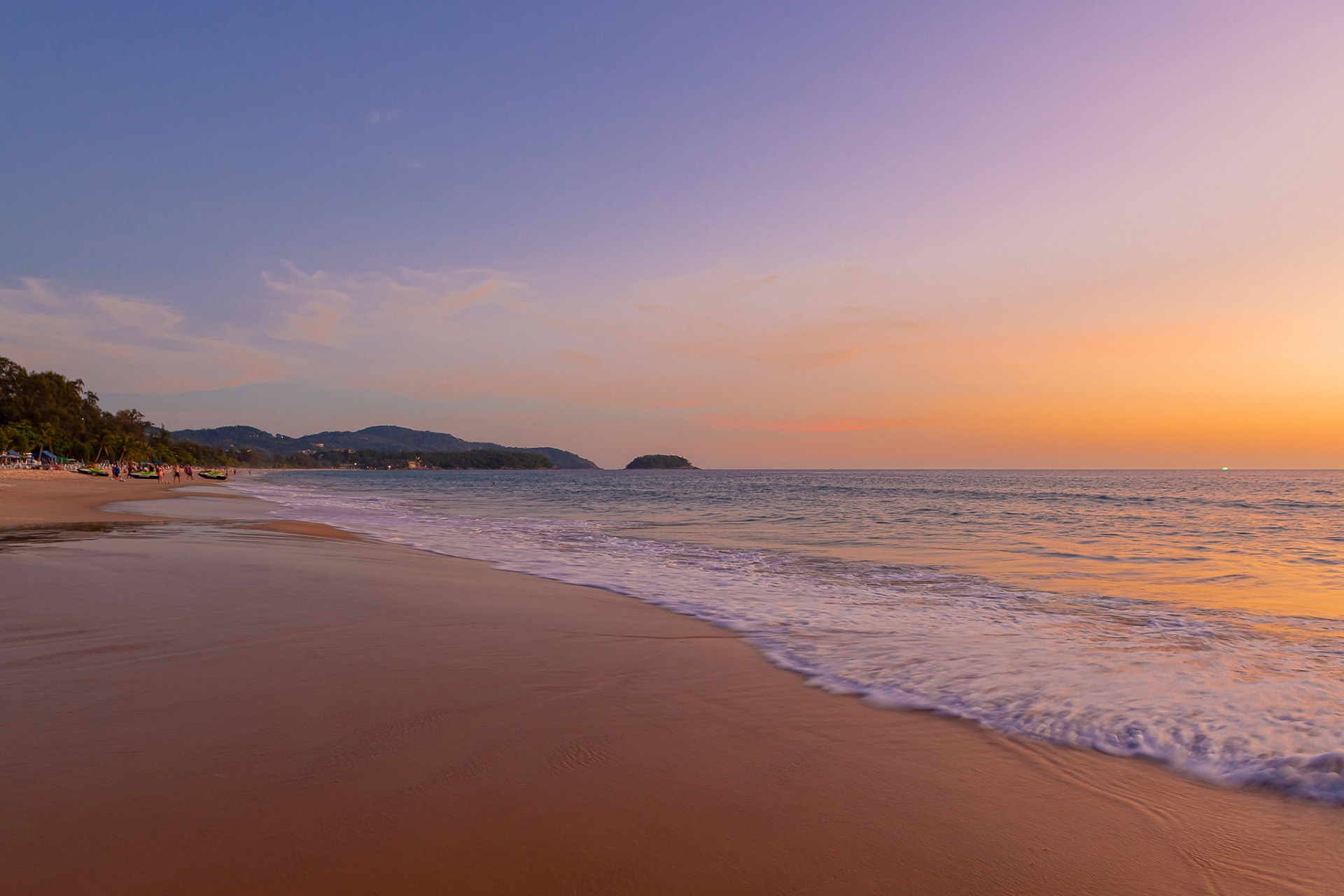 Karon Beach during sunset with the view of Poo island
